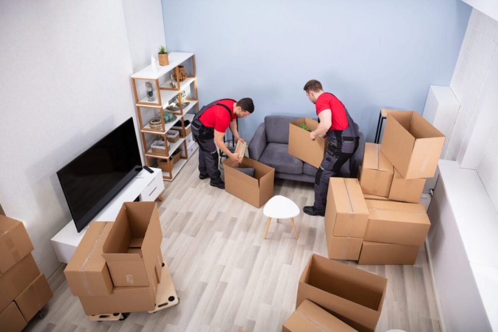House movers packing boxes and furniture during a home relocation in Abu Dhabi